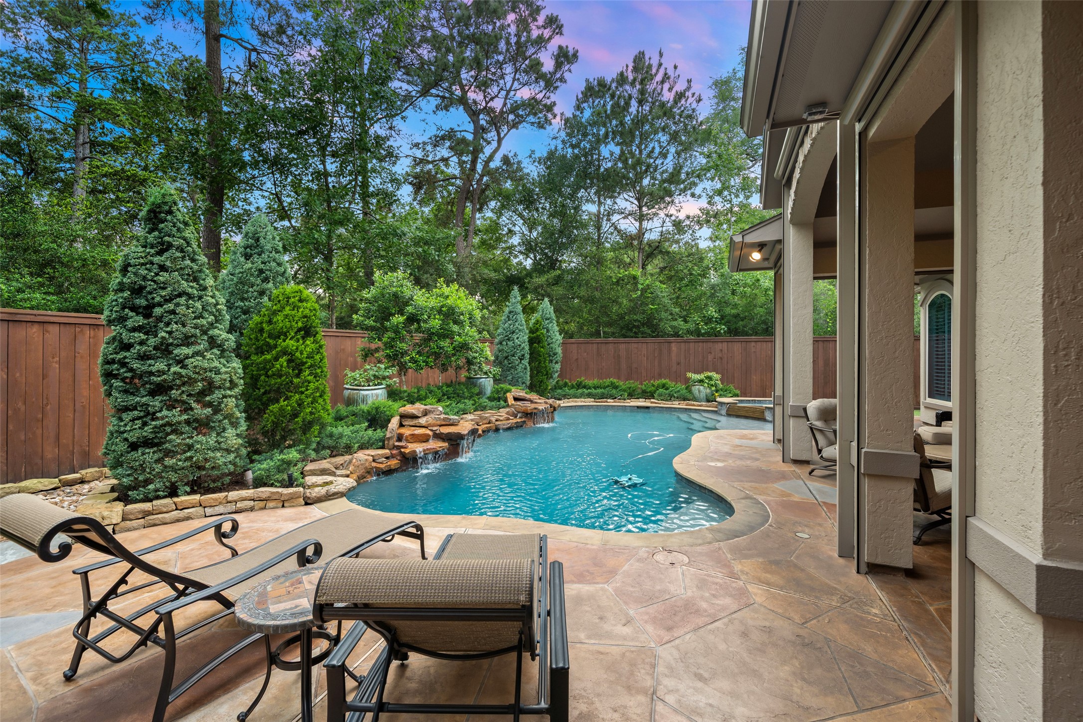59 East Ambassador Bend Spring, TX 77382 - Photo 35 of 48 Another perspective of the sparkling pool and spa demonstrates the evergreen professional landscaping and the privacy afforded by this backyard.