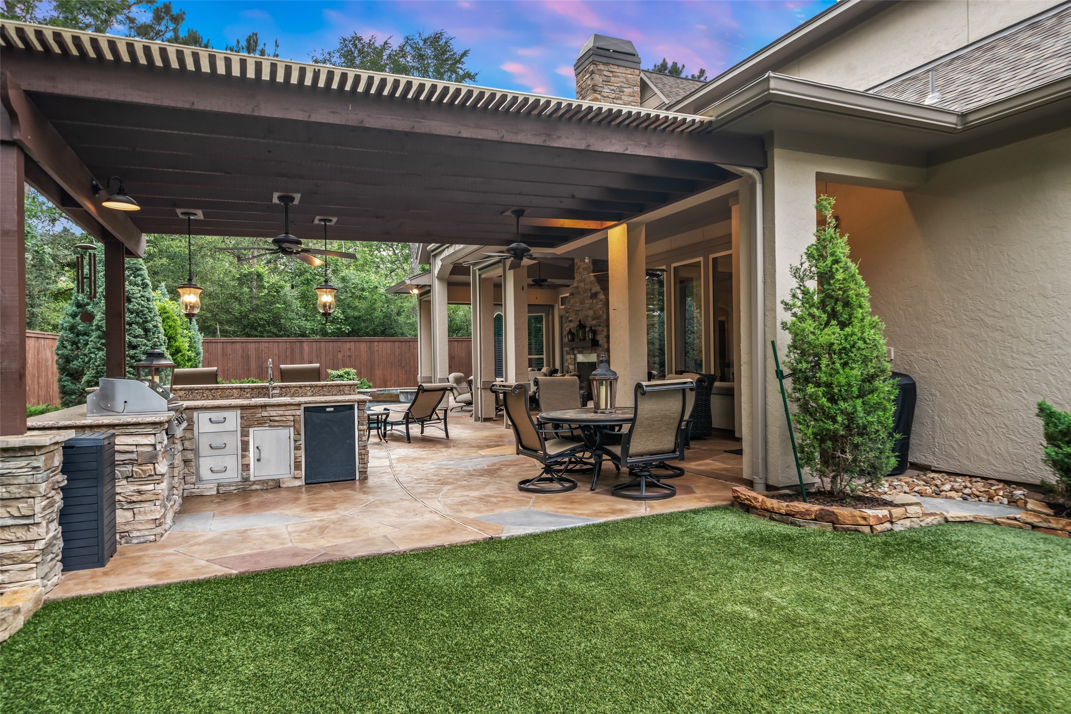 59 East Ambassador Bend Spring, TX 77382 - Photo 39 of 48 Another view of the outdoor kitchen featuring low maintenance pet-friendly turf!