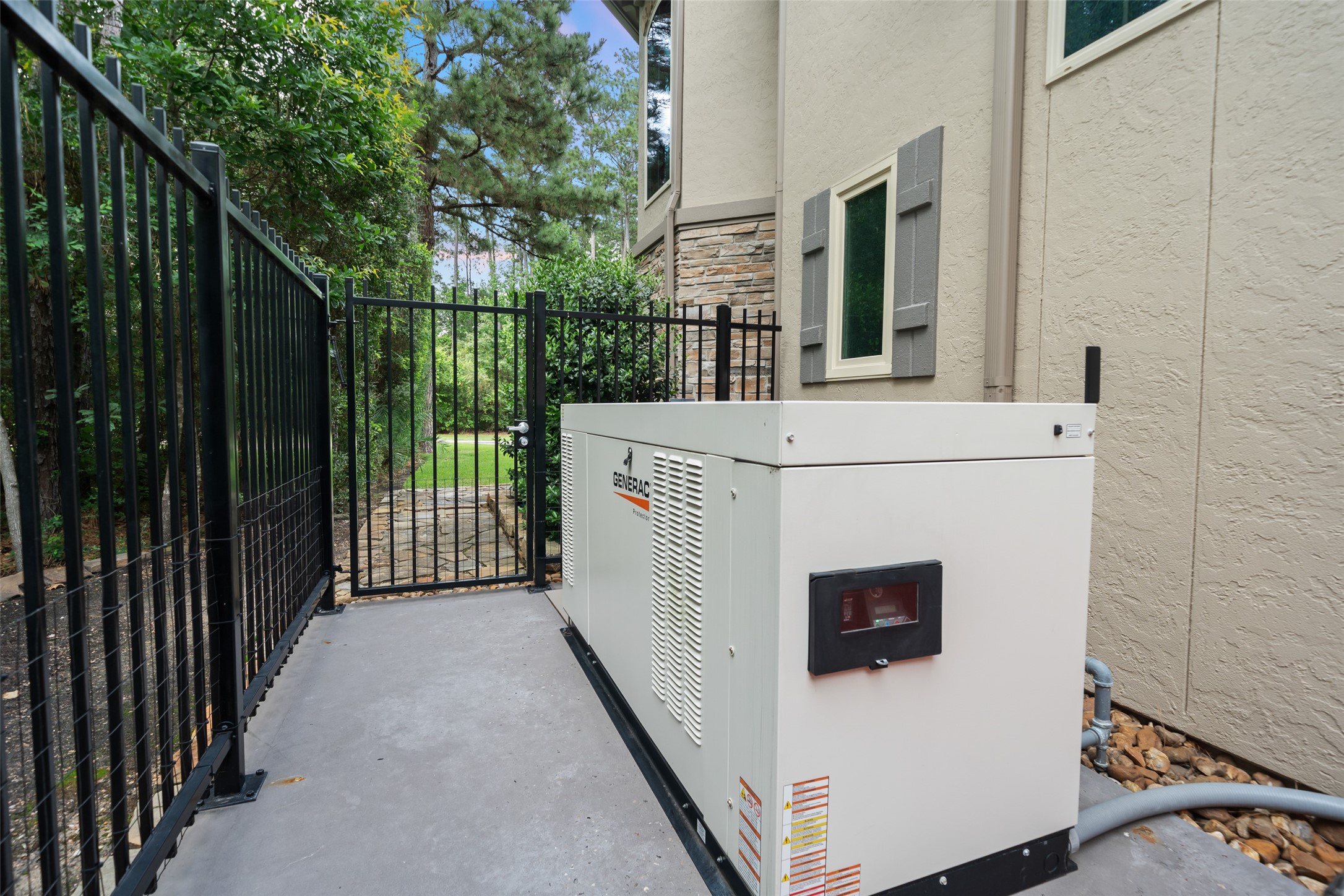 59 East Ambassador Bend Spring, TX 77382 - Photo 44 of 48 A view of the newer Generac 48 KW whole house generator (22) and Auto transfer switch with a seven-year warranty. The home is extremely energy efficient with the help of three new HVAC systems installed in 2022 with a 10 year warranty!