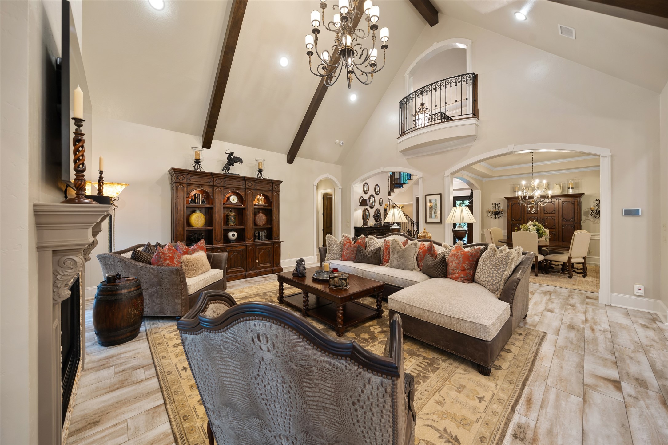 59 East Ambassador Bend Spring, TX 77382 - Photo 8 of 48 The generously sized living room features soaring ceilings serves as the heart of the home. A Juliet balcony offers views from the second level landing.