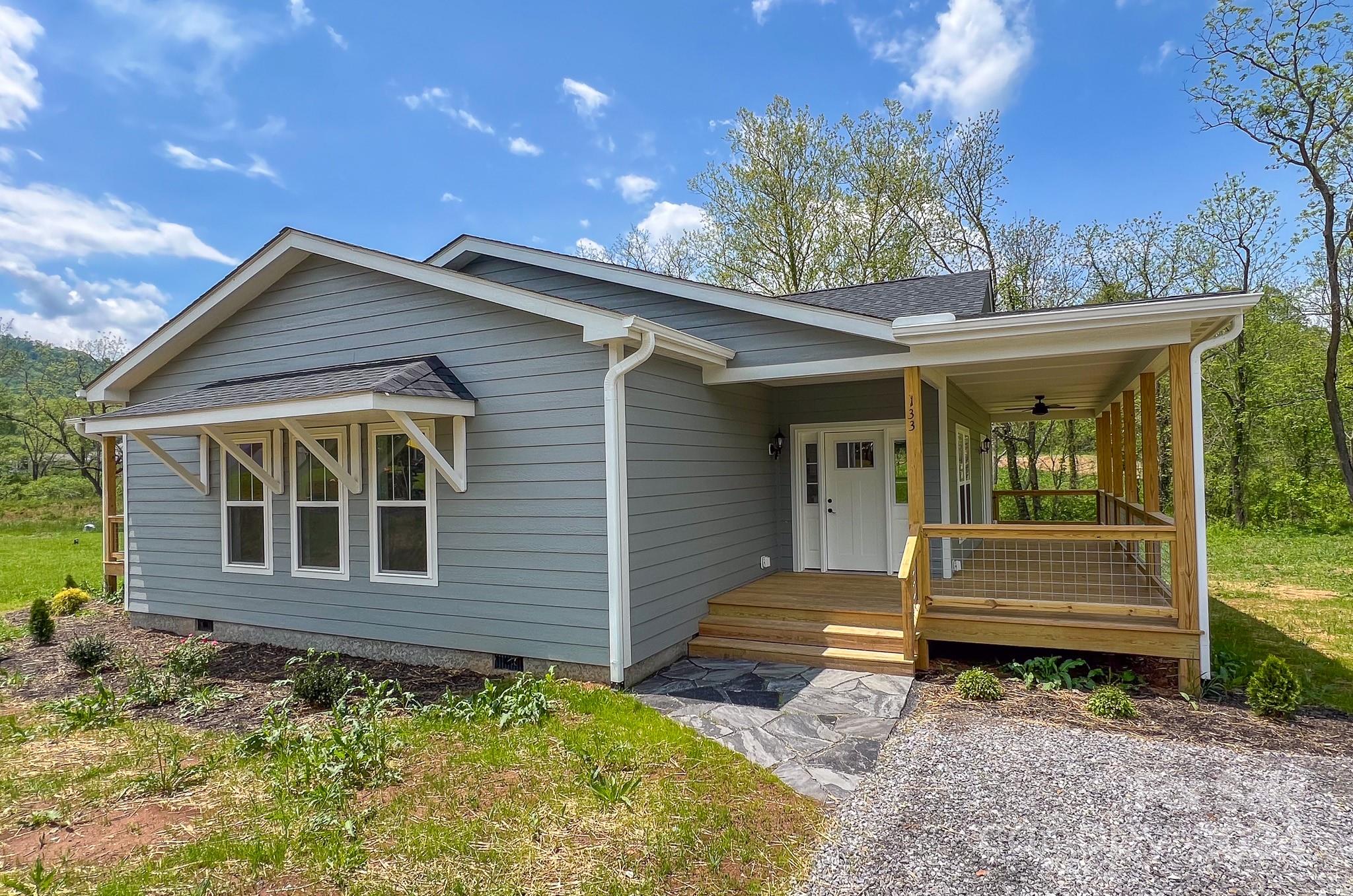 133 Rdg Vw Drive, Unit 20 Clyde, NC 28721 - Photo 1 of 17 a front view of a house with garden