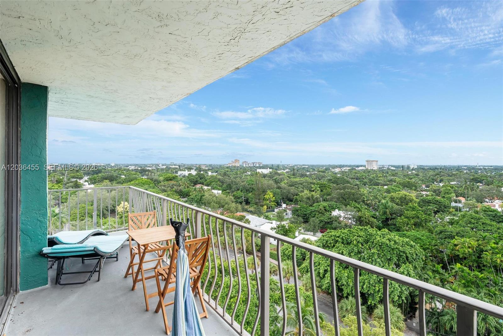 780 Northeast 69th Street, Unit 1010 Miami, FL 33138 - Photo 14 of 31 a view of a balcony with mountain view and wooden floor