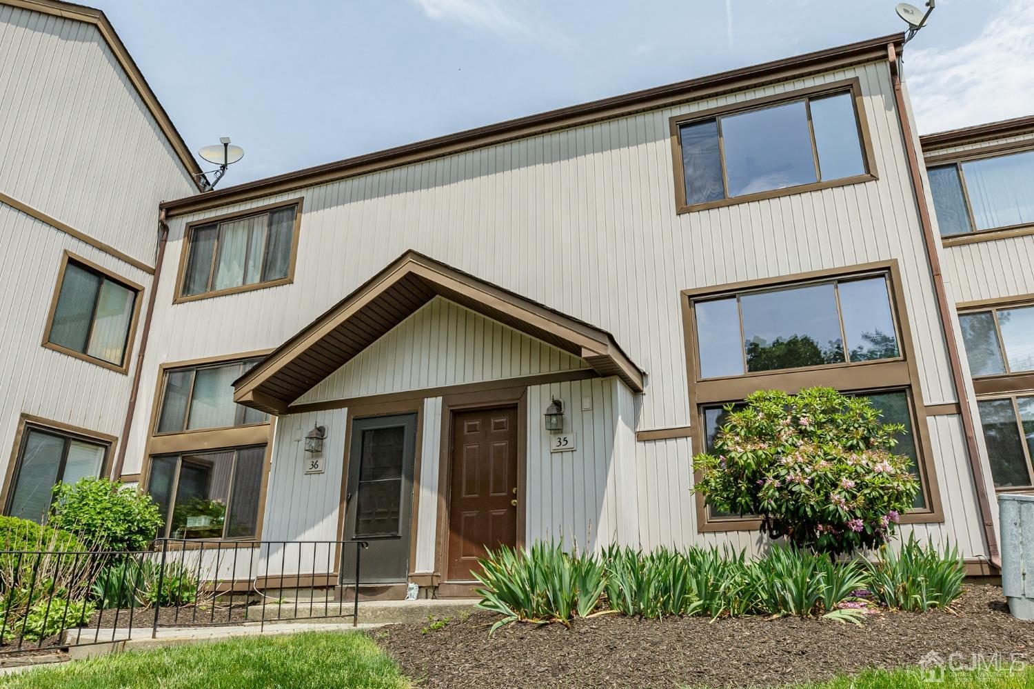 335 Alpine Court, Unit 35 Stanhope, NJ 07874 - Photo 1 of 32 a front view of a house with a yard