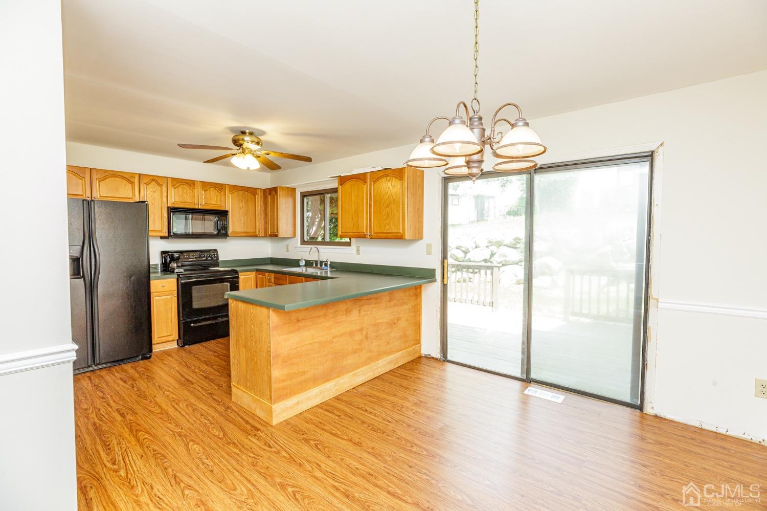 335 Alpine Court, Unit 35 Stanhope, NJ 07874 - Photo 12 of 32 a kitchen with stainless steel appliances granite countertop a refrigerator and a stove top oven