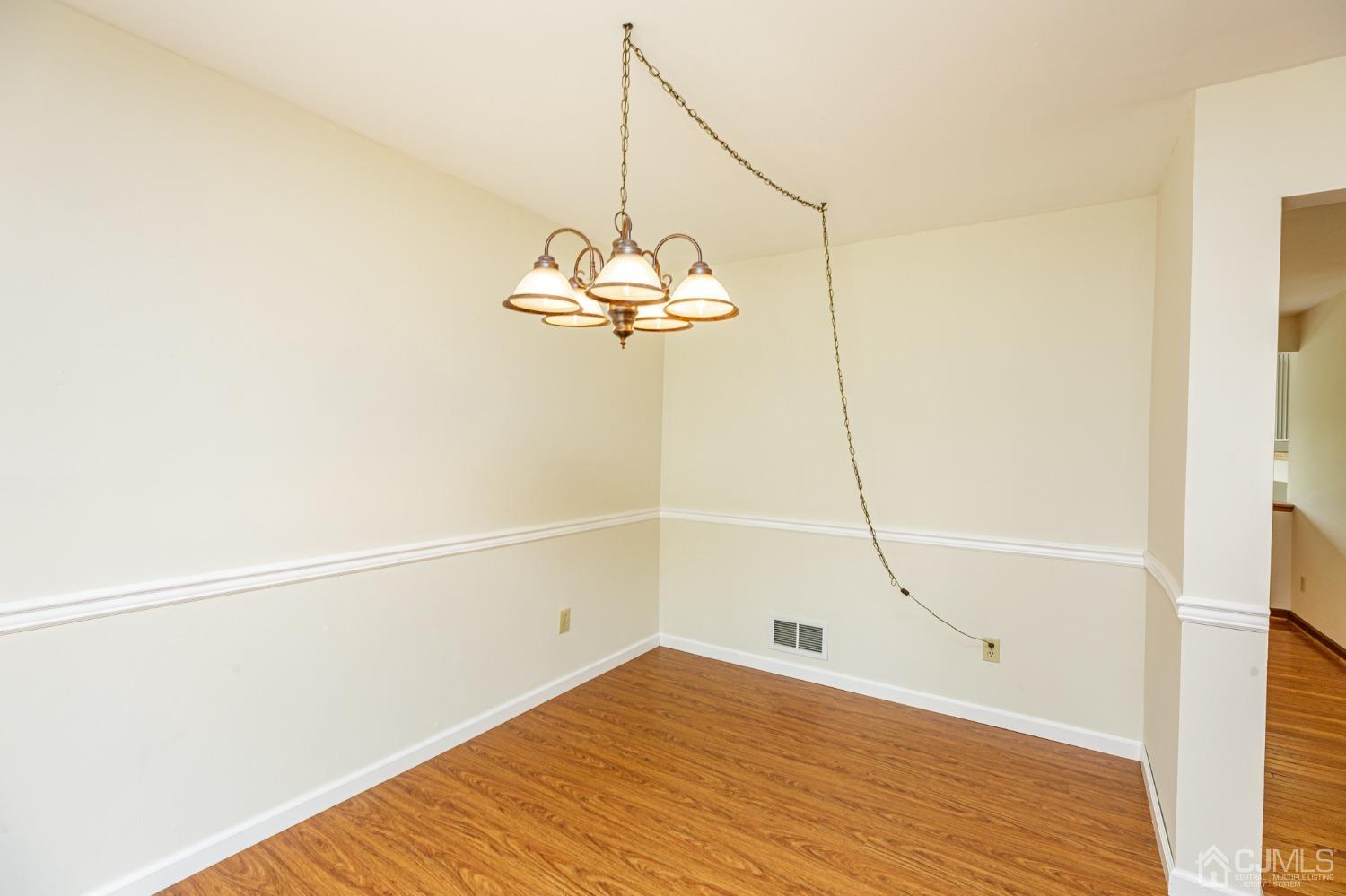 335 Alpine Court, Unit 35 Stanhope, NJ 07874 - Photo 14 of 32 a view of a room with wooden floor and windows