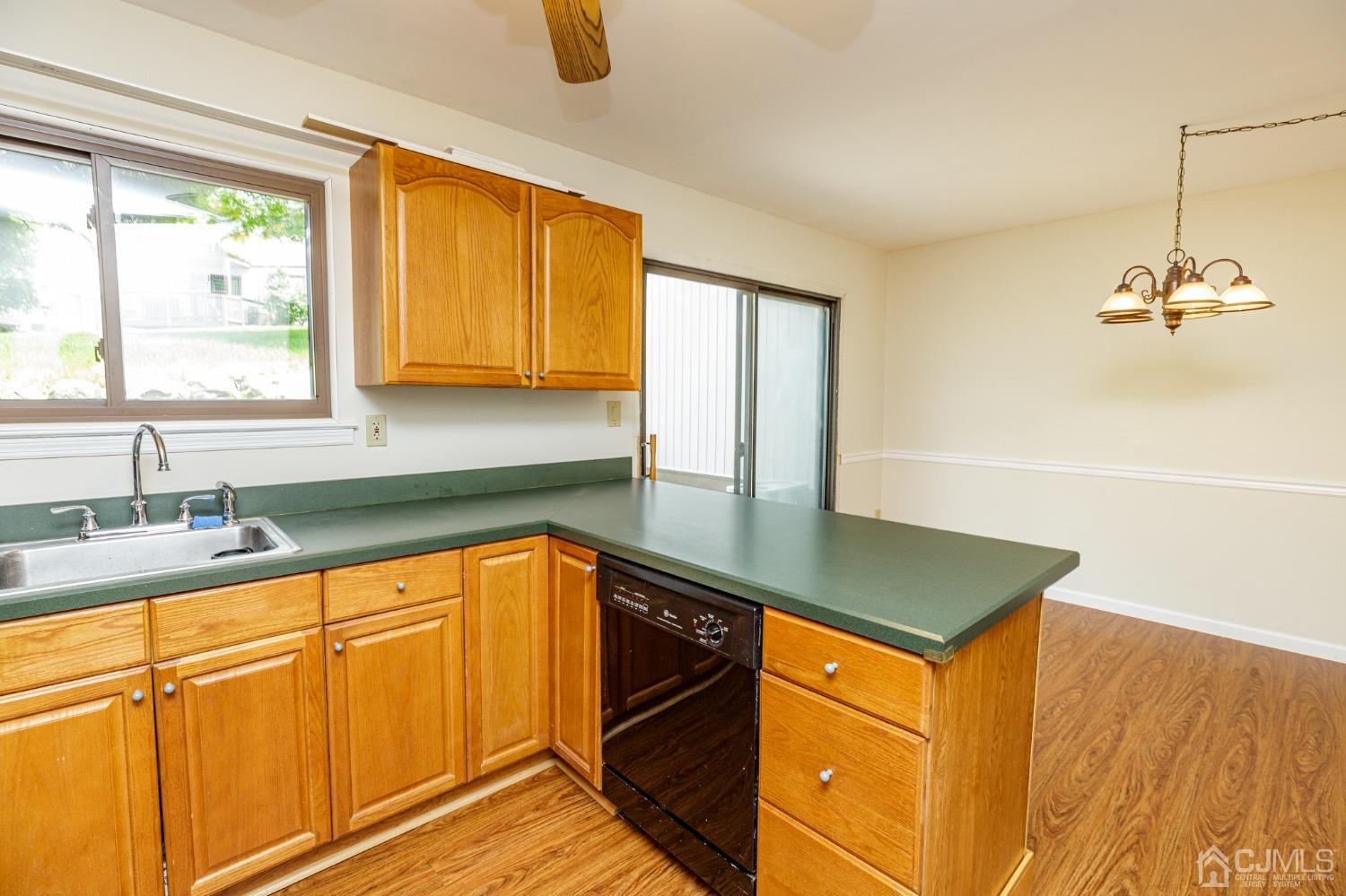 335 Alpine Court, Unit 35 Stanhope, NJ 07874 - Photo 16 of 32 a kitchen with stainless steel appliances granite countertop a sink and a cabinets
