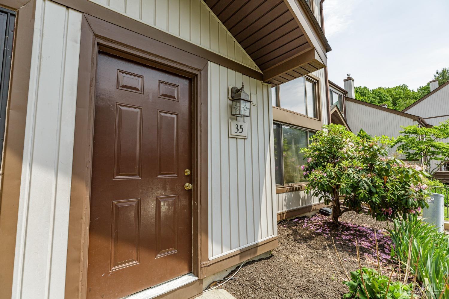 335 Alpine Court, Unit 35 Stanhope, NJ 07874 - Photo 2 of 32 a view of a house with a backyard