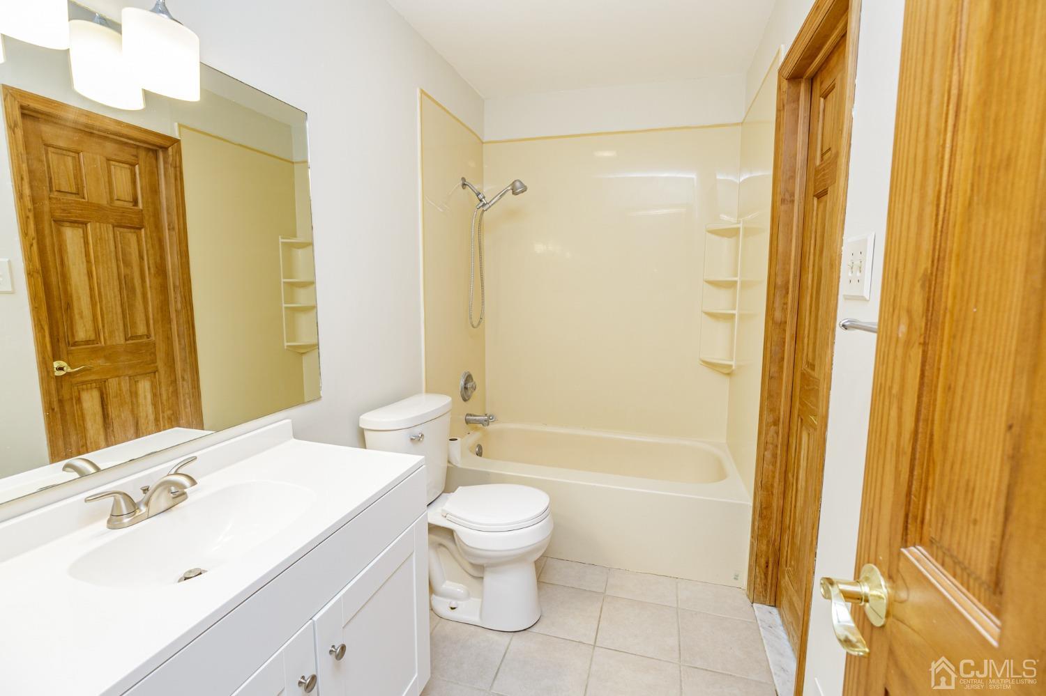 335 Alpine Court, Unit 35 Stanhope, NJ 07874 - Photo 22 of 32 a bathroom with a sink toilet and shower