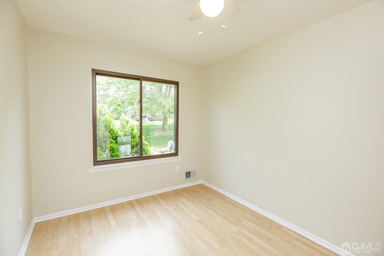 335 Alpine Court, Unit 35 Stanhope, NJ 07874 - Photo 23 of 32 an empty room with a window
