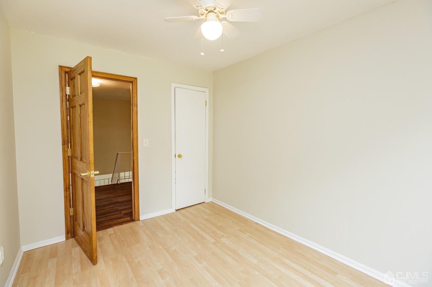 335 Alpine Court, Unit 35 Stanhope, NJ 07874 - Photo 25 of 32 a view of empty room with wooden floor