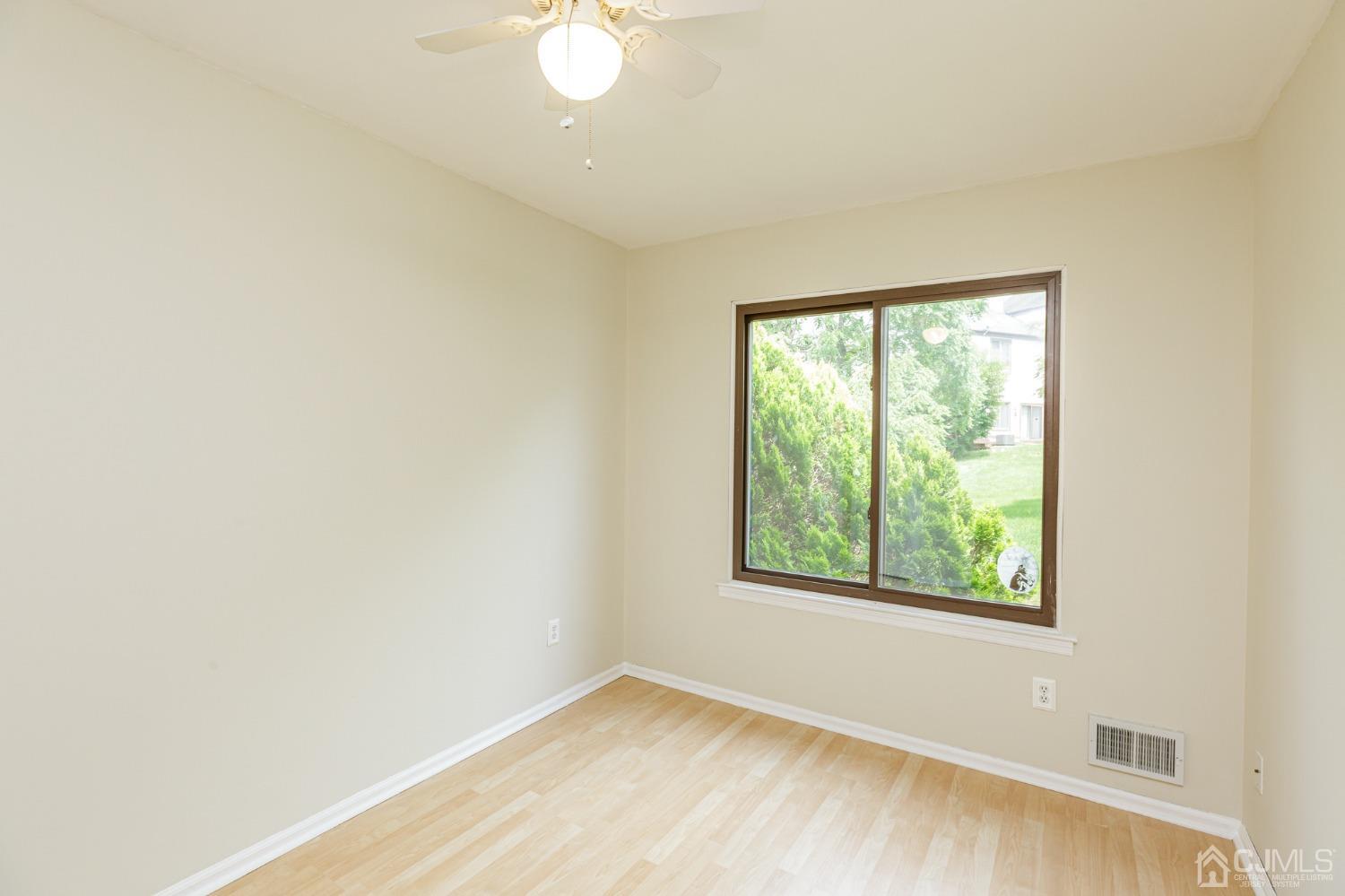 335 Alpine Court, Unit 35 Stanhope, NJ 07874 - Photo 26 of 32 an empty room with windows