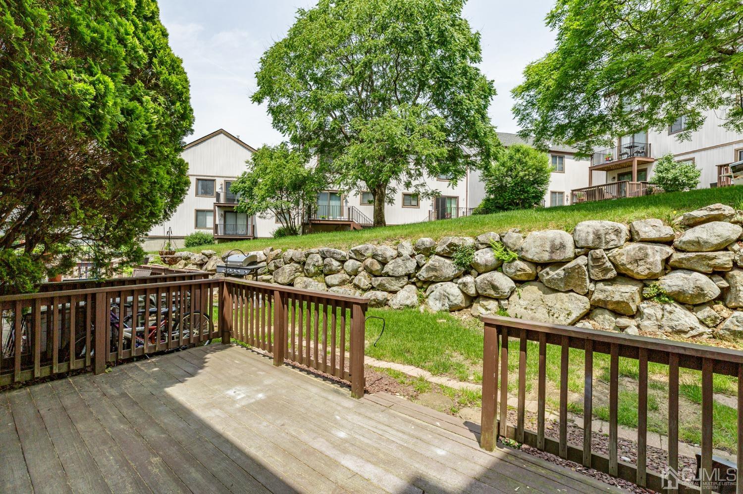 335 Alpine Court, Unit 35 Stanhope, NJ 07874 - Photo 31 of 32 a view of a balcony with wooden floor