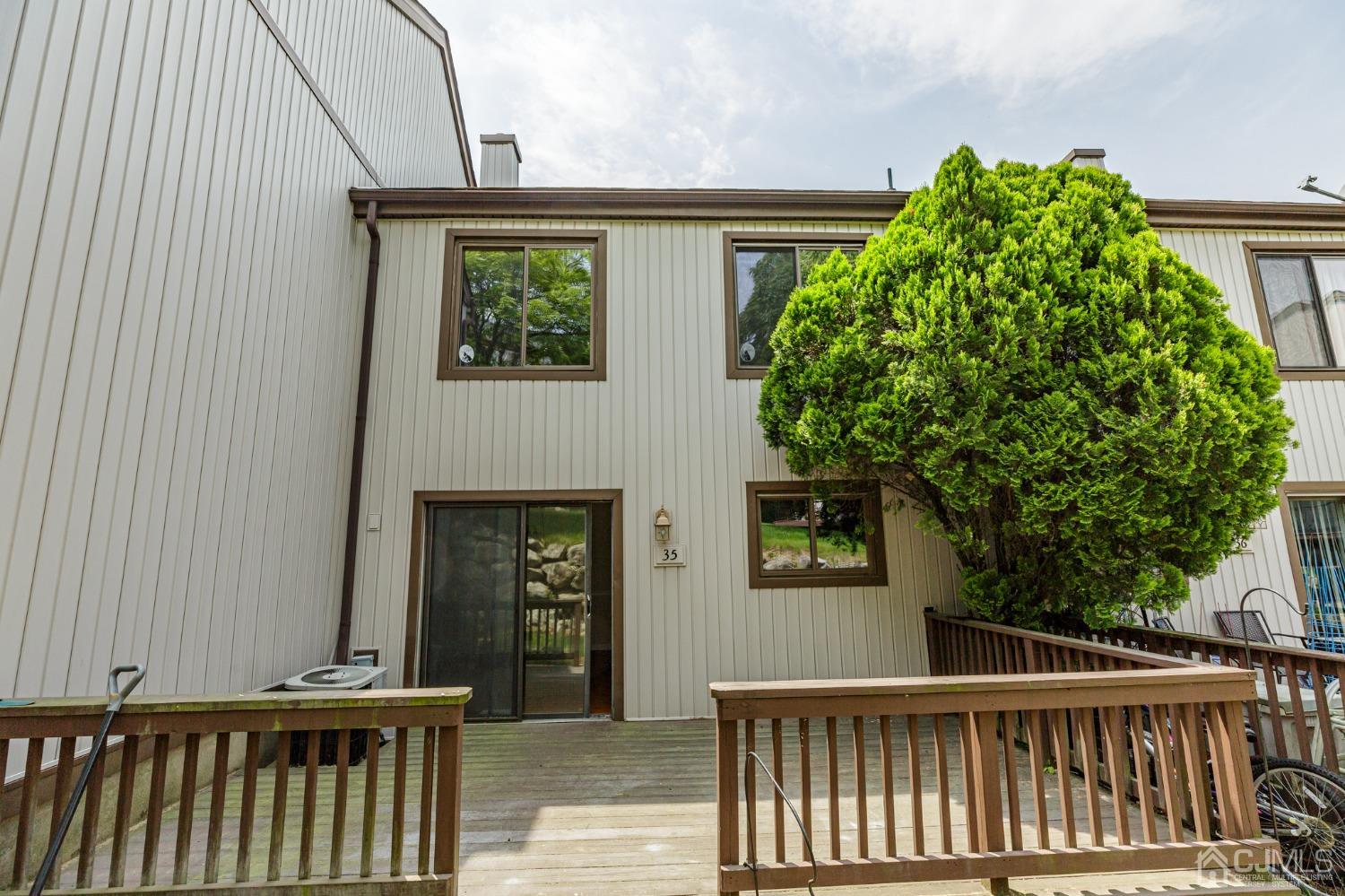335 Alpine Court, Unit 35 Stanhope, NJ 07874 - Photo 32 of 32 a view of a house with a small yard and wooden floor