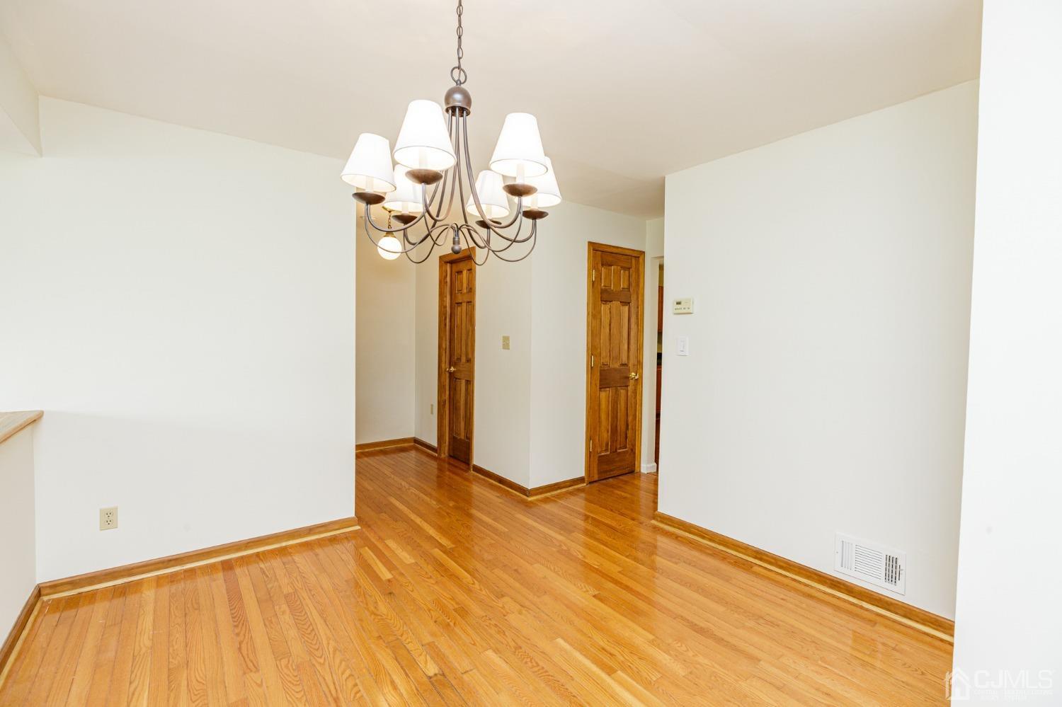 335 Alpine Court, Unit 35 Stanhope, NJ 07874 - Photo 10 of 32 a view of a room with wooden floor