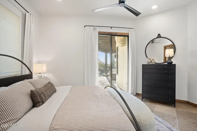 a view of a house with swimming pool and sitting area