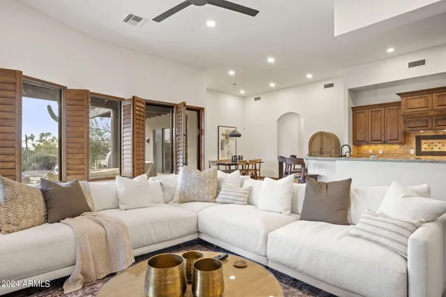 a view of a dining room with furniture and window