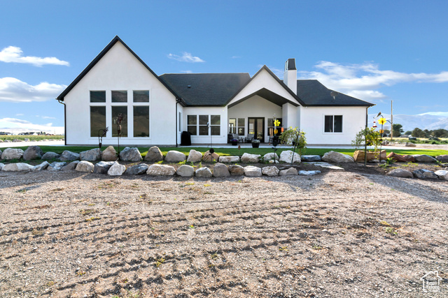 1952 Highway 118 Monroe, UT 84754 - Photo 4 of 88 Rear view of house with stucco siding and a chimney