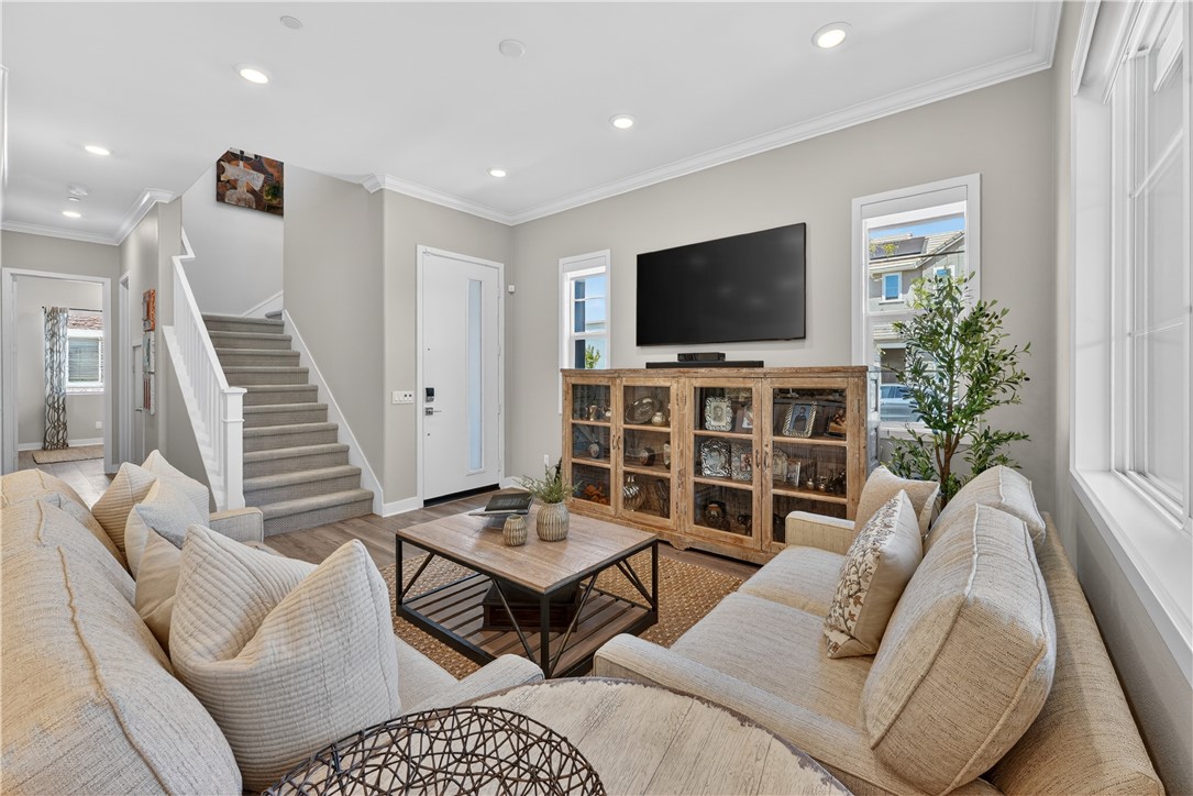 752 Sunrise Road Rancho Mission Viejo, CA 92694 - Photo 5 of 73 a living room with furniture and a flat screen tv