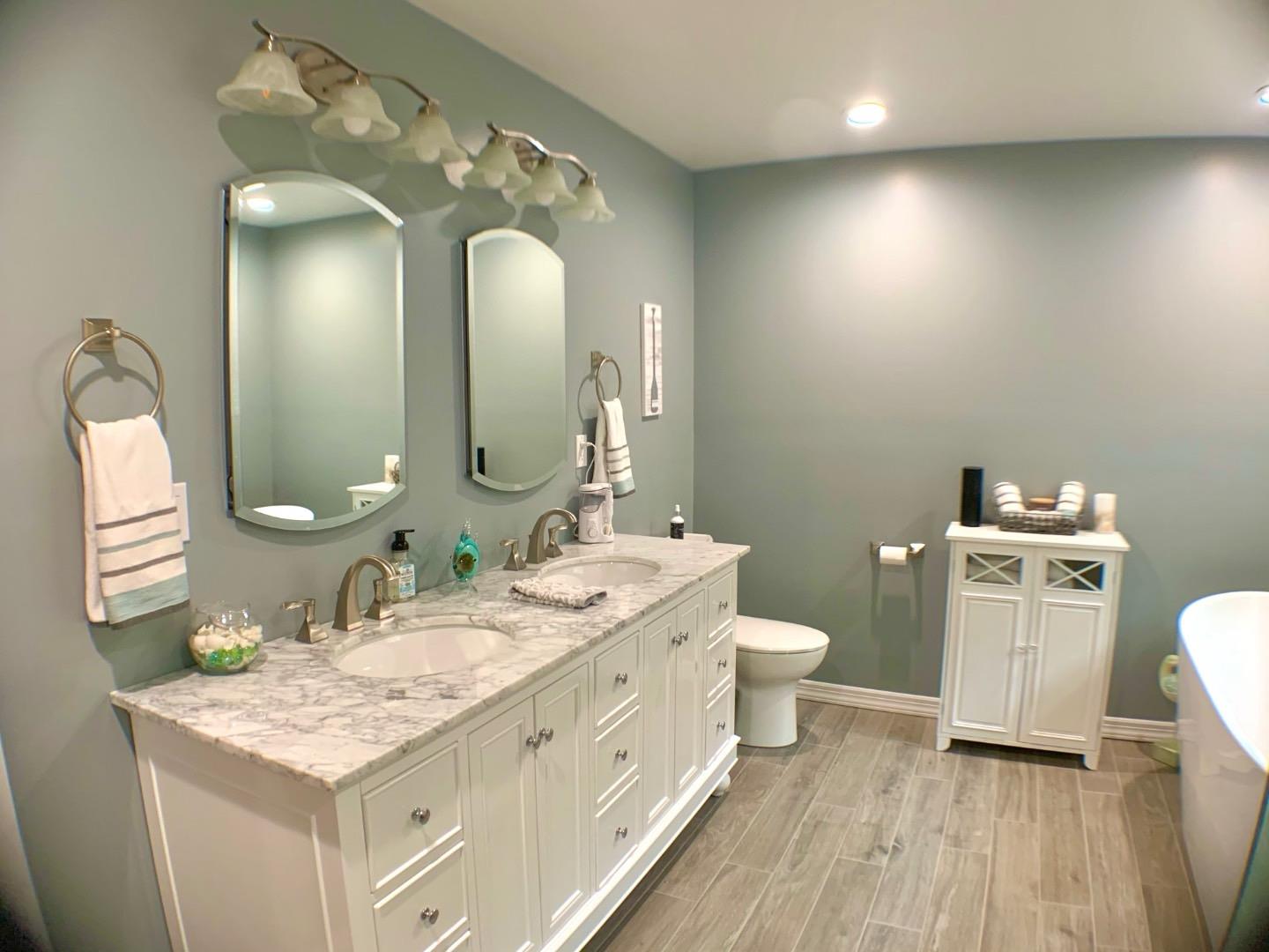 5 Spruce Street East Hampton, NY 11937 - Photo 12 of 16 Full bath with baseboards, wood finished floors, toilet, and a sink