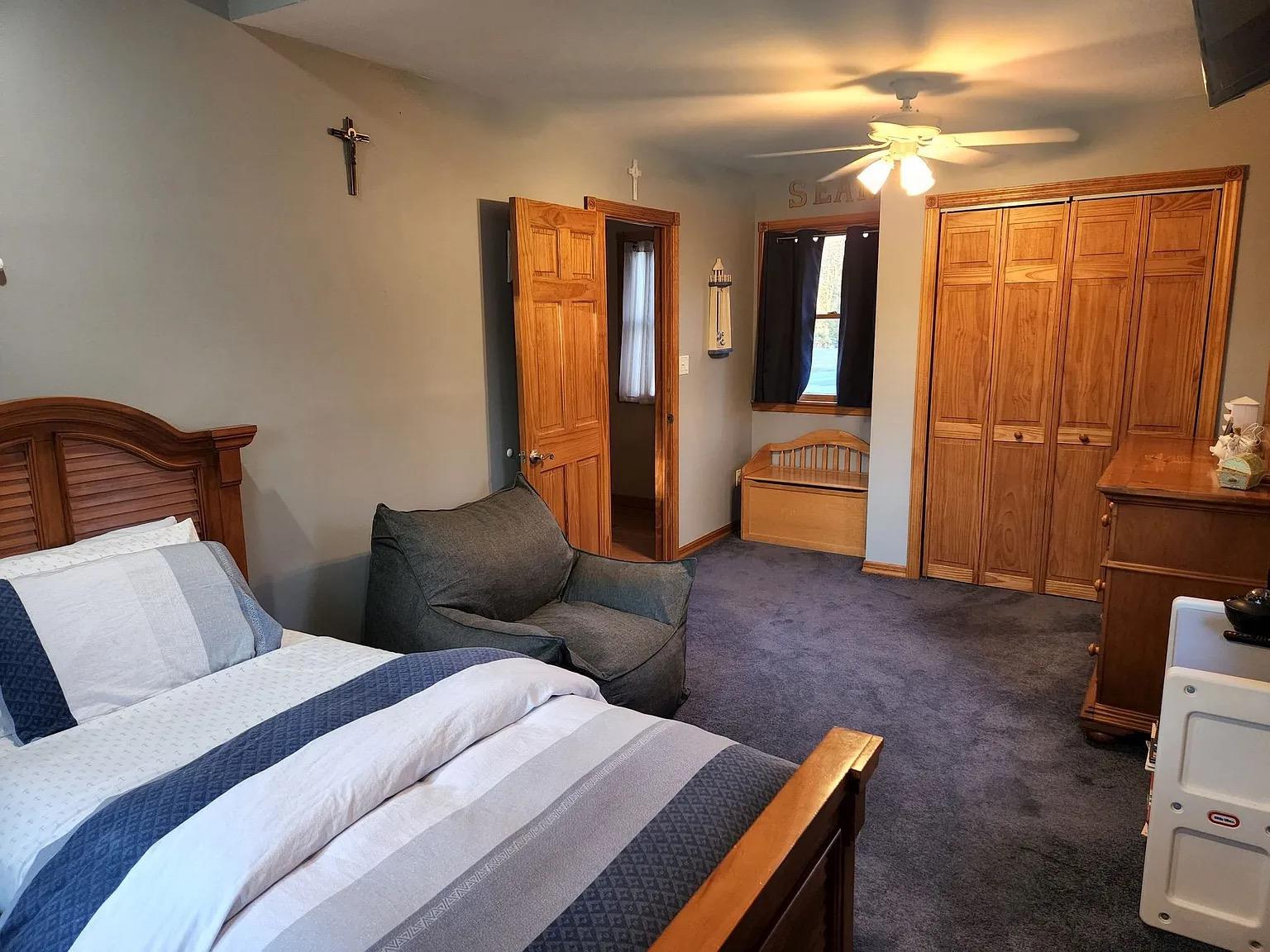 5 Spruce Street East Hampton, NY 11937 - Photo 16 of 16 Bedroom featuring a ceiling fan, baseboards, and dark colored carpet