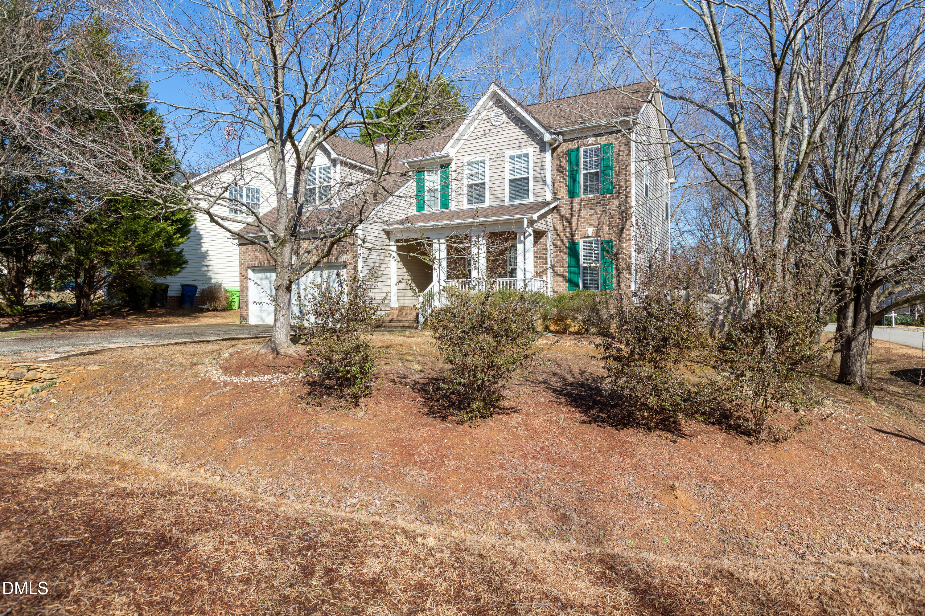 2339 School Creek Place Raleigh, NC 27606 - Photo 2 of 59 a front view of house with yard and trees around