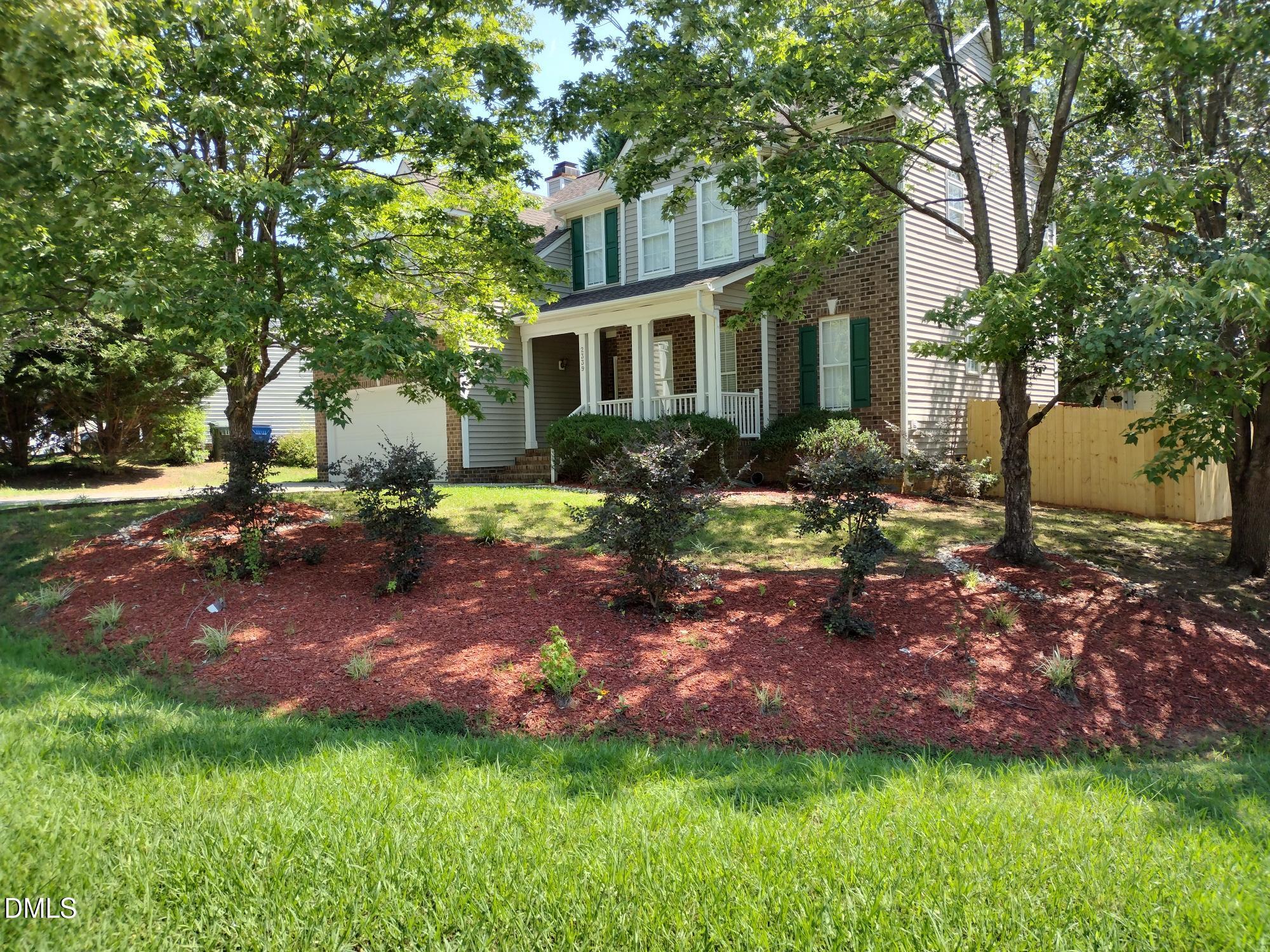 2339 School Creek Place Raleigh, NC 27606 - Photo 3 of 11 a view of a house with a yard