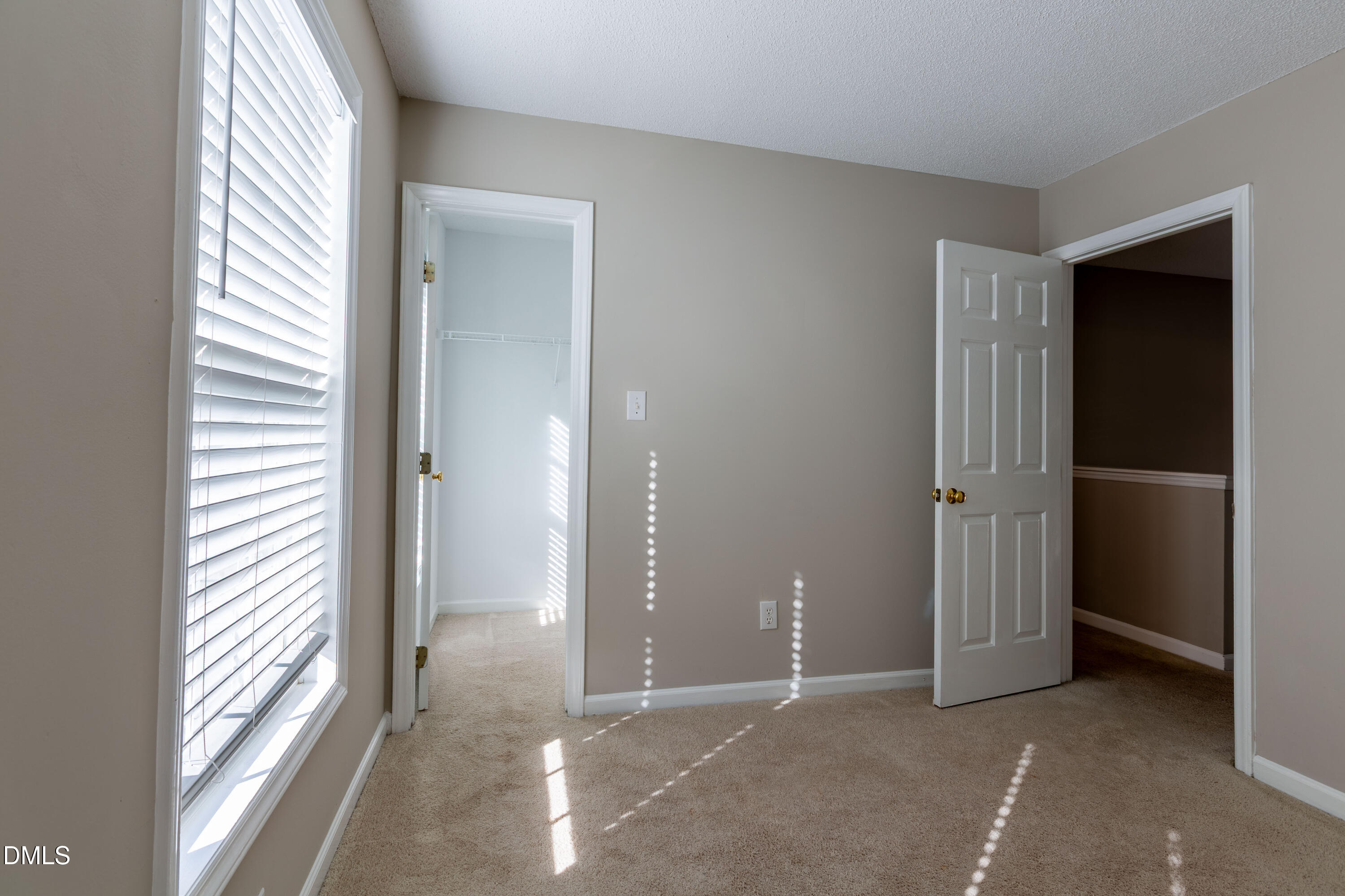 2339 School Creek Place Raleigh, NC 27606 - Photo 31 of 59 an empty room with windows and closet