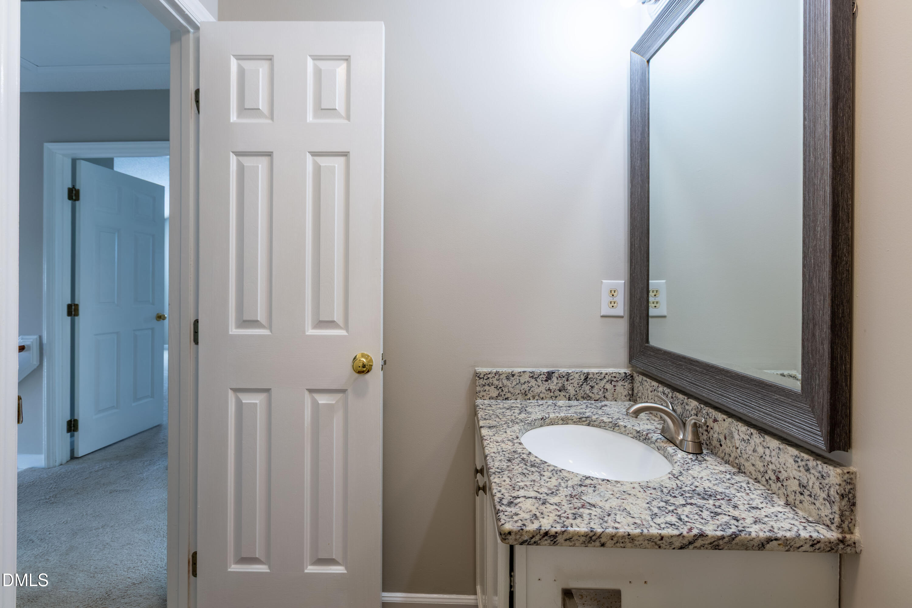 2339 School Creek Place Raleigh, NC 27606 - Photo 33 of 59 a bathroom with a granite countertop sink and a mirror