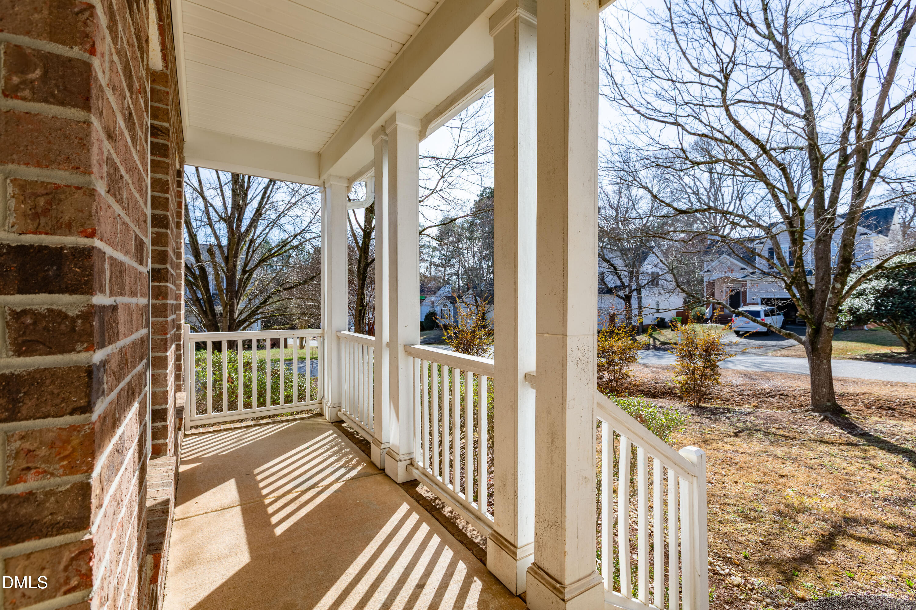 2339 School Creek Place Raleigh, NC 27606 - Photo 8 of 59 a view of a porch with wooden floor and fence