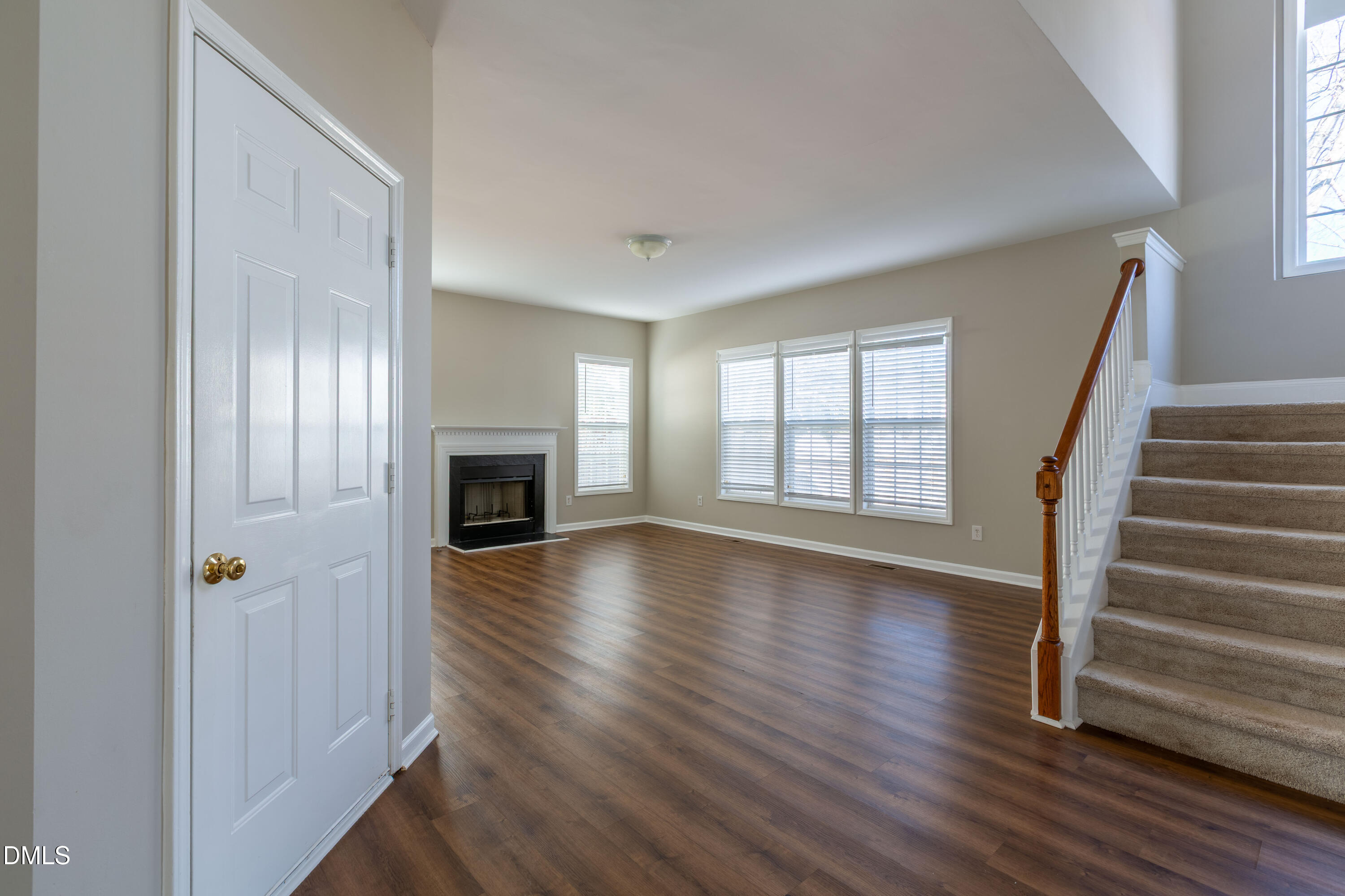 2339 School Creek Place Raleigh, NC 27606 - Photo 9 of 59 wooden floor in an empty room with a window