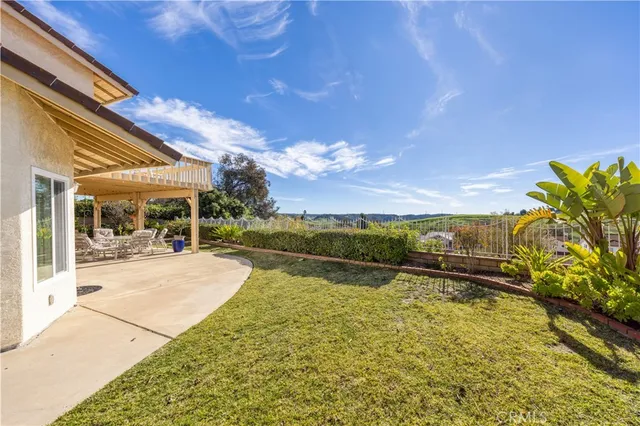 an aerial view of a house with garden space and a street view