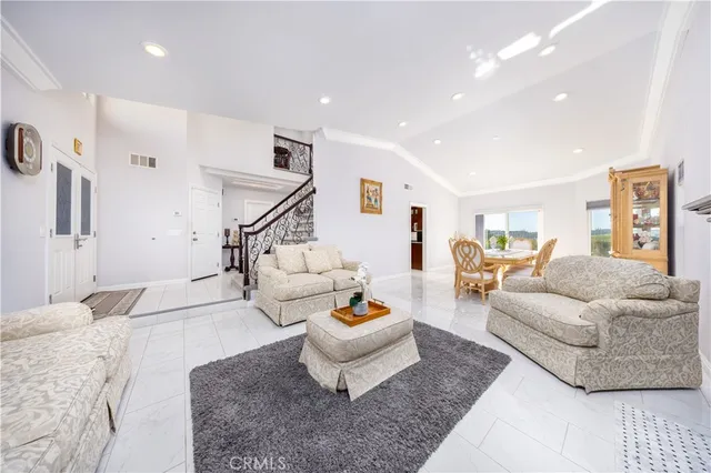 a living room with furniture and a rug