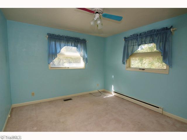 7005 Cruthis Road High Point, NC 27263 - Photo 8 of 13 2nd Bedroom. Bedrooms 2 and 3 are amply sized and both share the full bath in the hall.