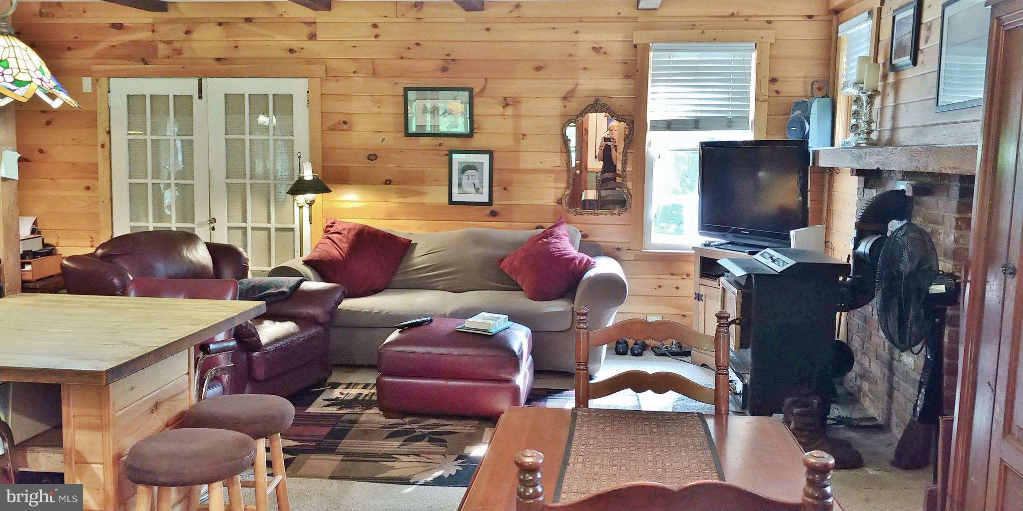 818 Worthington Mill Road Newtown, PA 18940 - Photo 11 of 29 Living room with tongue-and-groove pine paneling