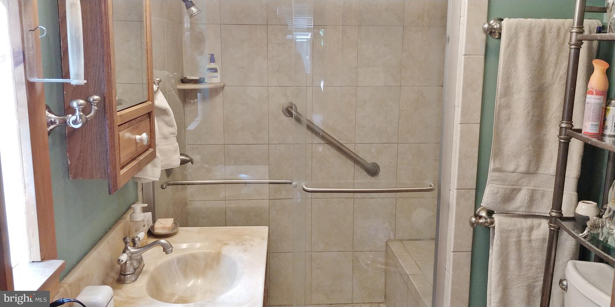 818 Worthington Mill Road Newtown, PA 18940 - Photo 20 of 29 Glass door shower with seat