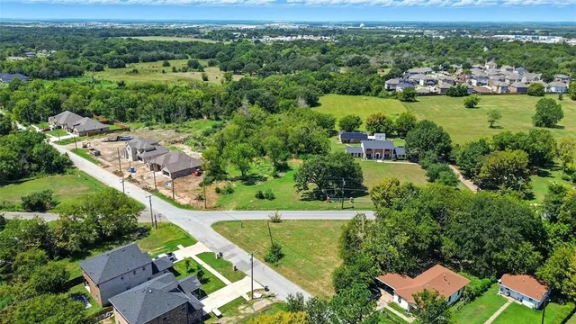 an aerial view of a house with a garden