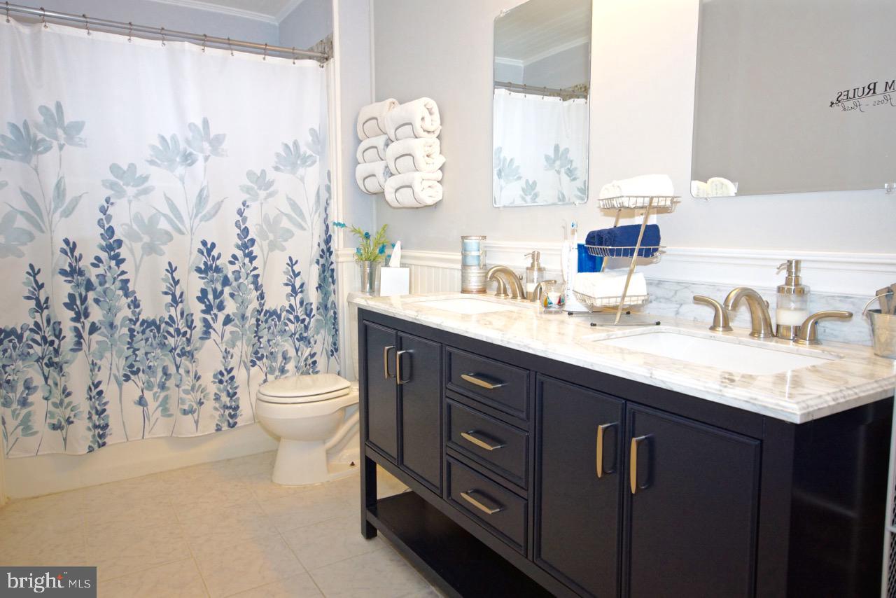 14 Constitution Road Clementon, NJ 08021 - Photo 11 of 27 a bathroom with a granite countertop sink toilet and mirror