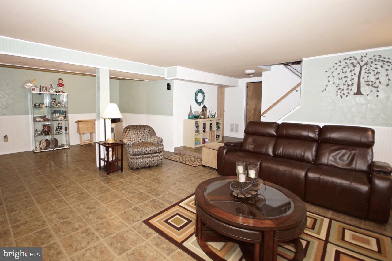 14 Constitution Road Clementon, NJ 08021 - Photo 17 of 27 a living room with furniture and a wooden floor