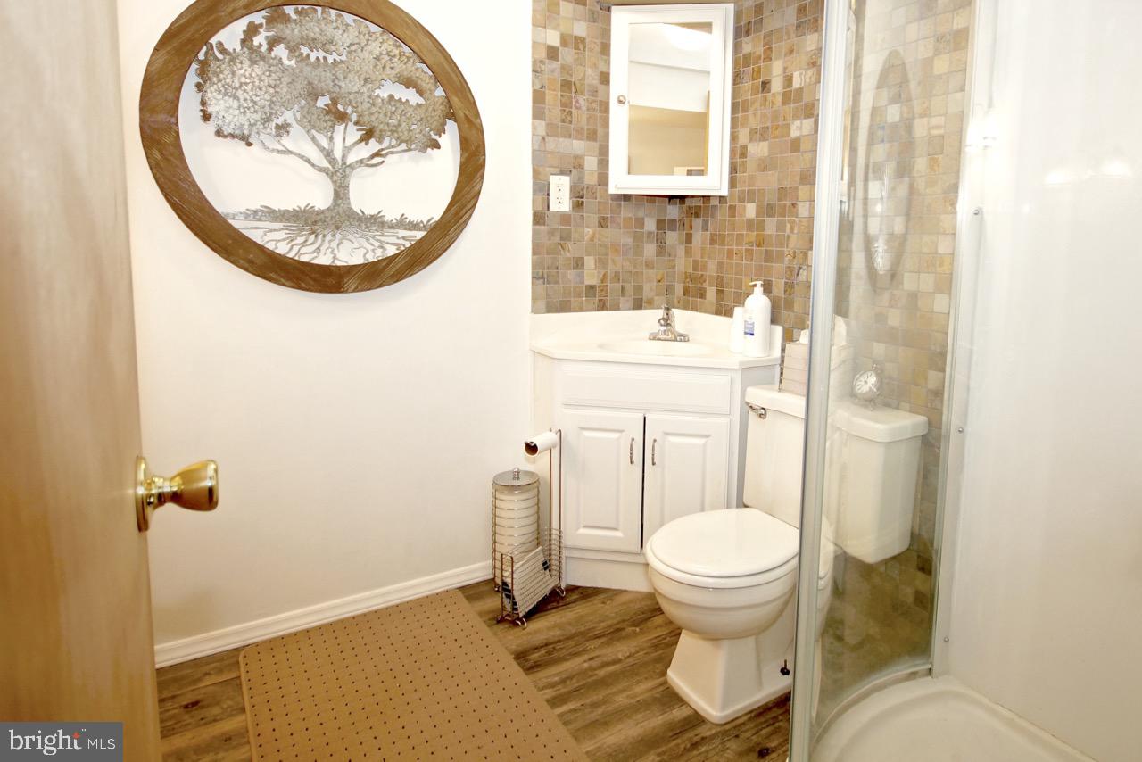 14 Constitution Road Clementon, NJ 08021 - Photo 22 of 27 a bathroom with a toilet and a mirror