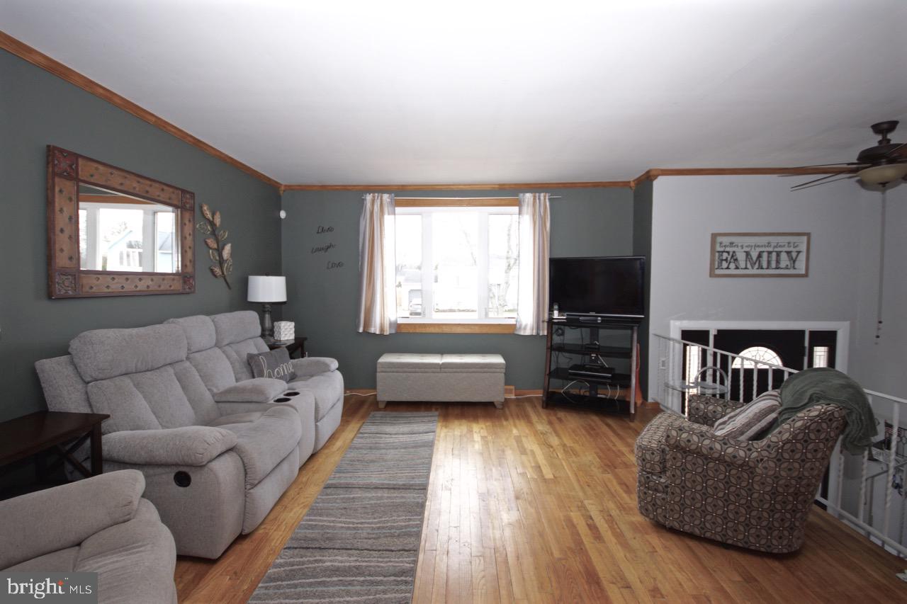 14 Constitution Road Clementon, NJ 08021 - Photo 4 of 27 a living room with furniture and a flat screen tv
