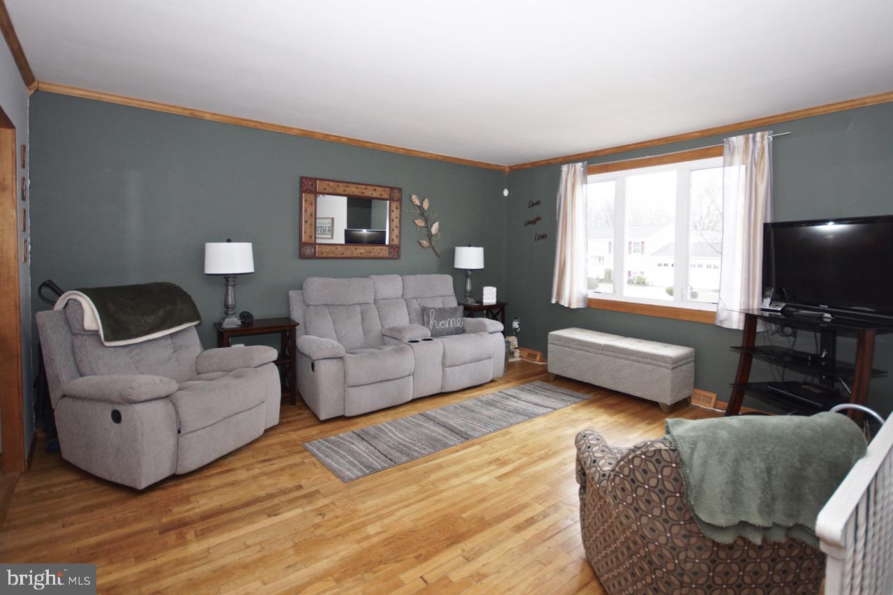 14 Constitution Road Clementon, NJ 08021 - Photo 5 of 27 a living room with furniture and a flat screen tv