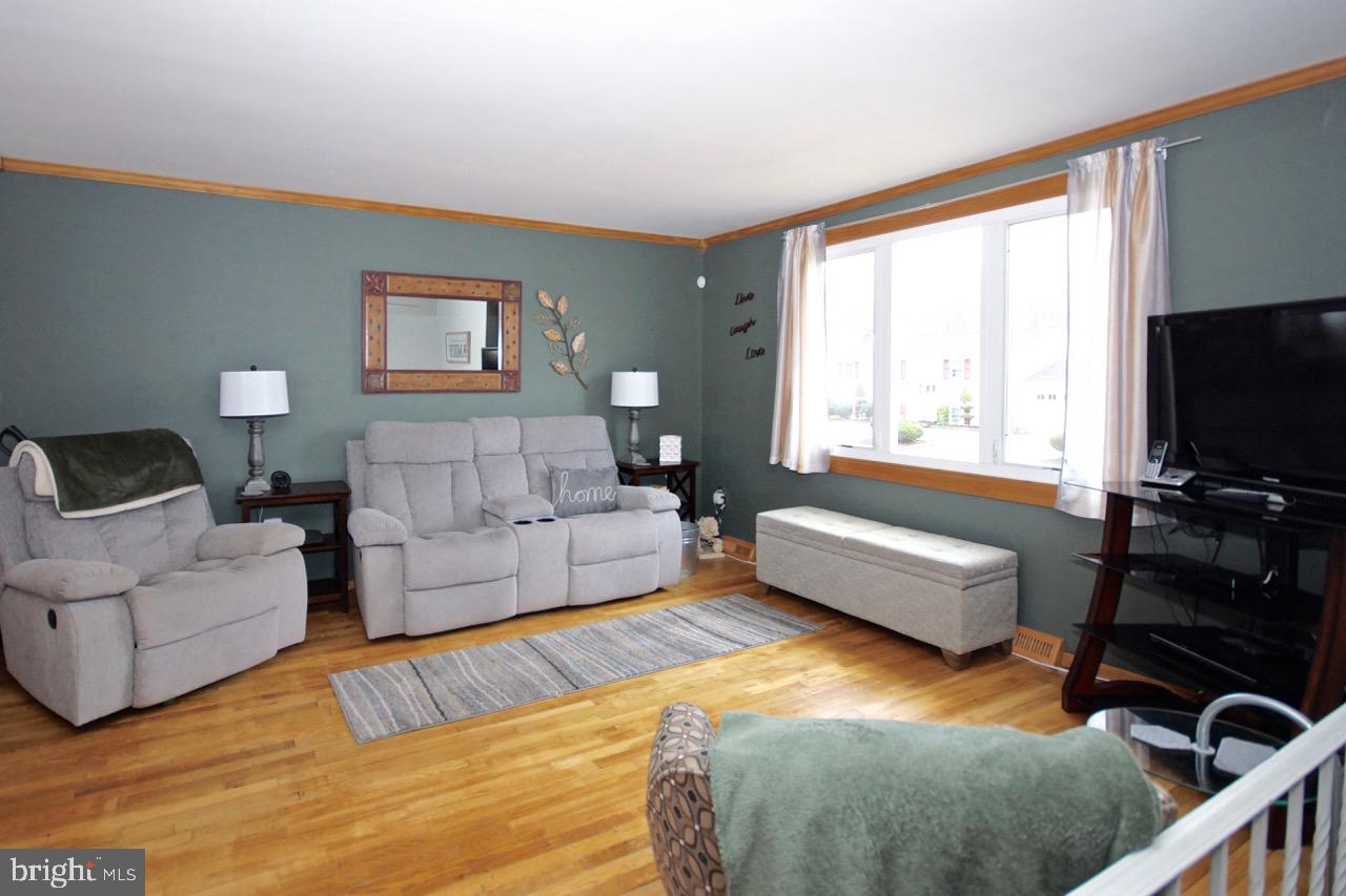 14 Constitution Road Clementon, NJ 08021 - Photo 6 of 27 a living room with furniture and a flat screen tv