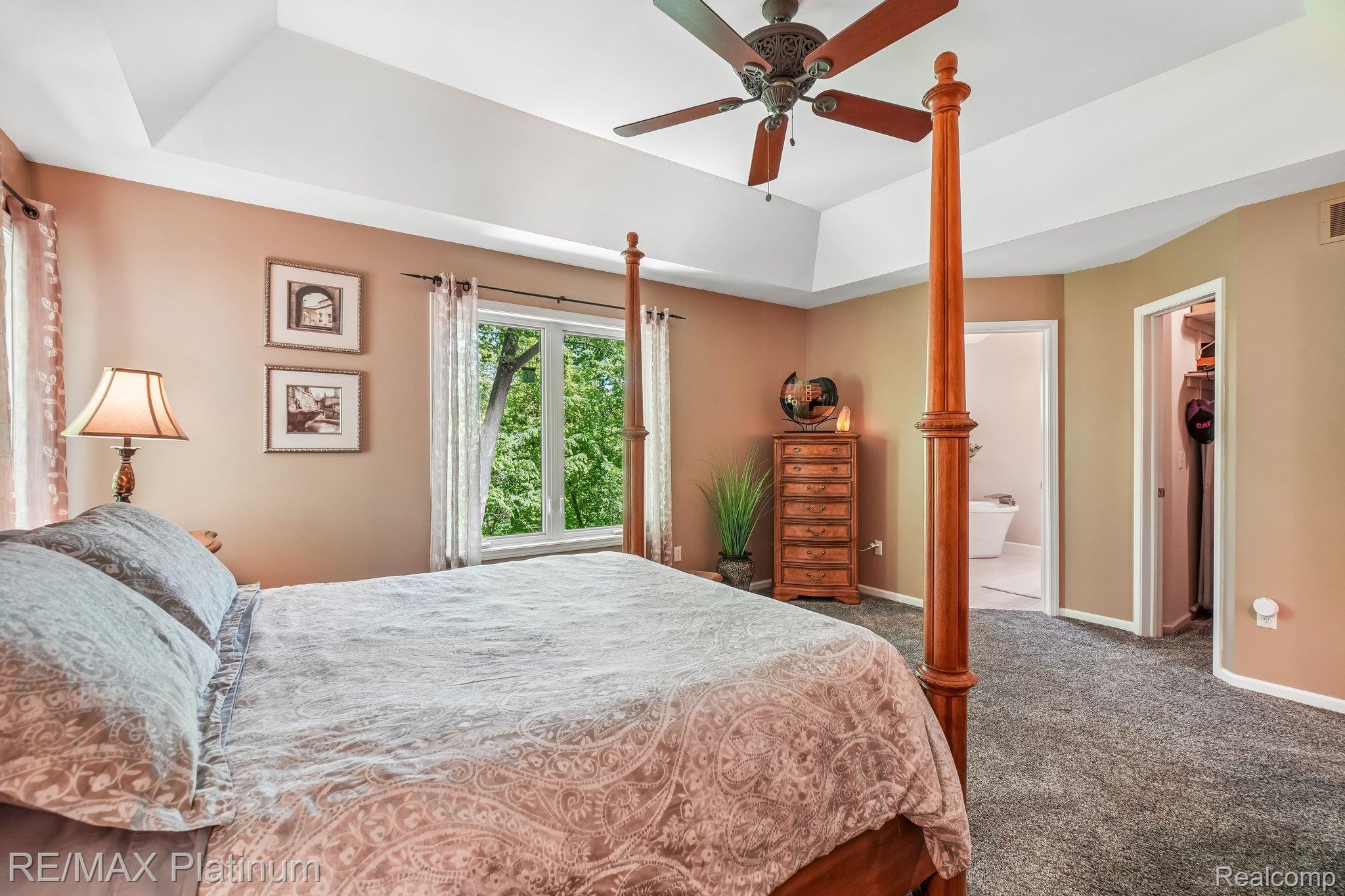 2260 Moorland's View Howell, MI 48855 - Photo 18 of 40 Primary Bedroom with Tray ceiling, en-suite and walk-in closet