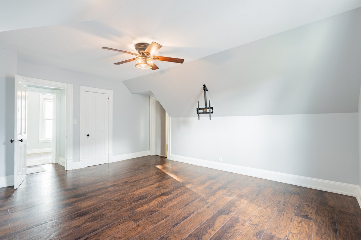 802 South Fell Avenue Normal, IL 61761 - Photo 16 of 25 a view of a room with wooden floor and ceiling fan