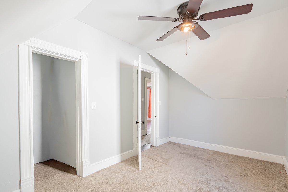 802 South Fell Avenue Normal, IL 61761 - Photo 18 of 25 an empty room with closet and a ceiling fan