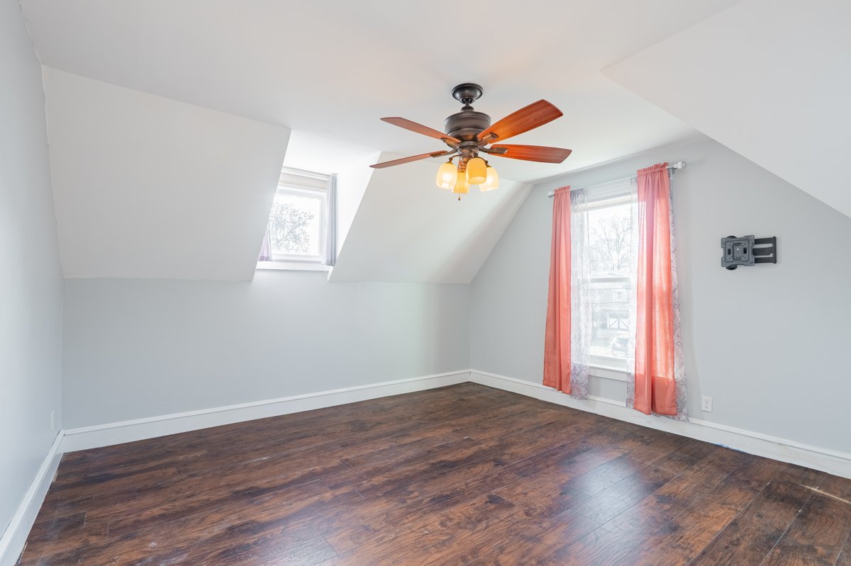 802 South Fell Avenue Normal, IL 61761 - Photo 20 of 25 an empty room with wooden floor and windows