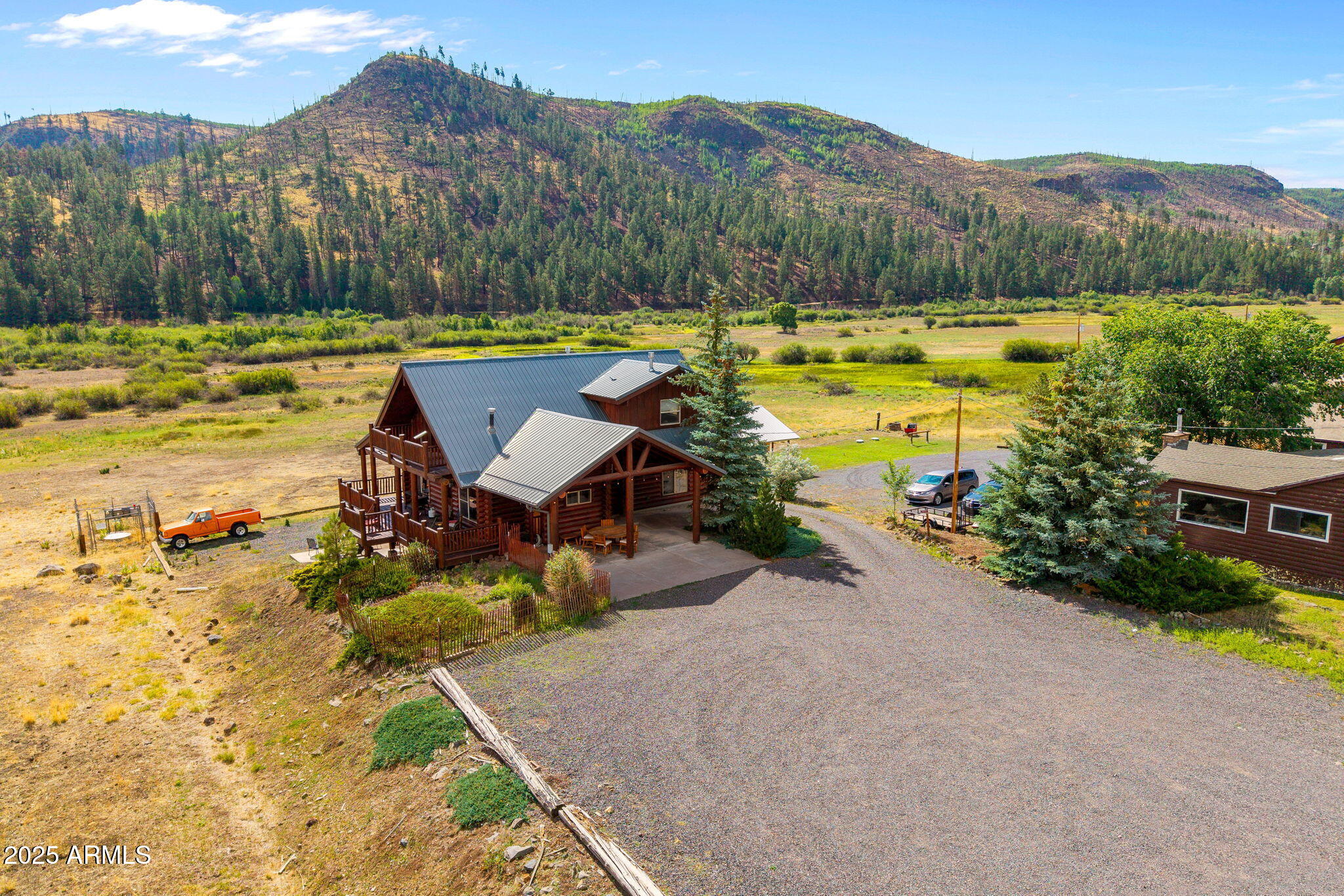 100 Main Street Greer, AZ 85925 - Photo 8 of 63 a view of a lake with a mountain