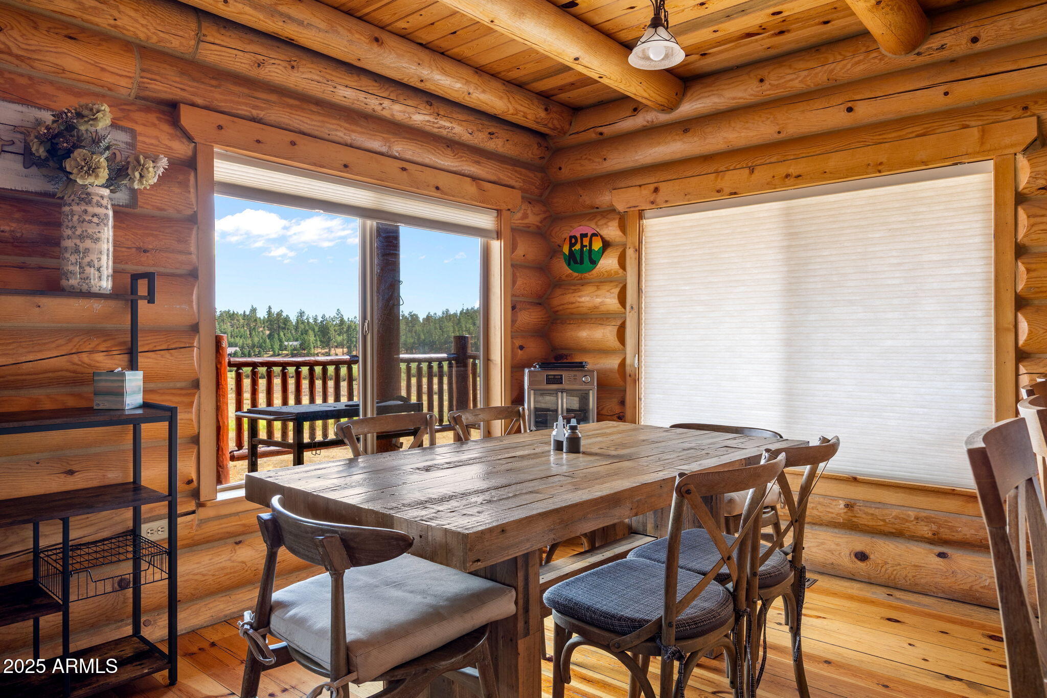 100 Main Street Greer, AZ 85925 - Photo 17 of 63 a view of a dining room with furniture window and wooden floor