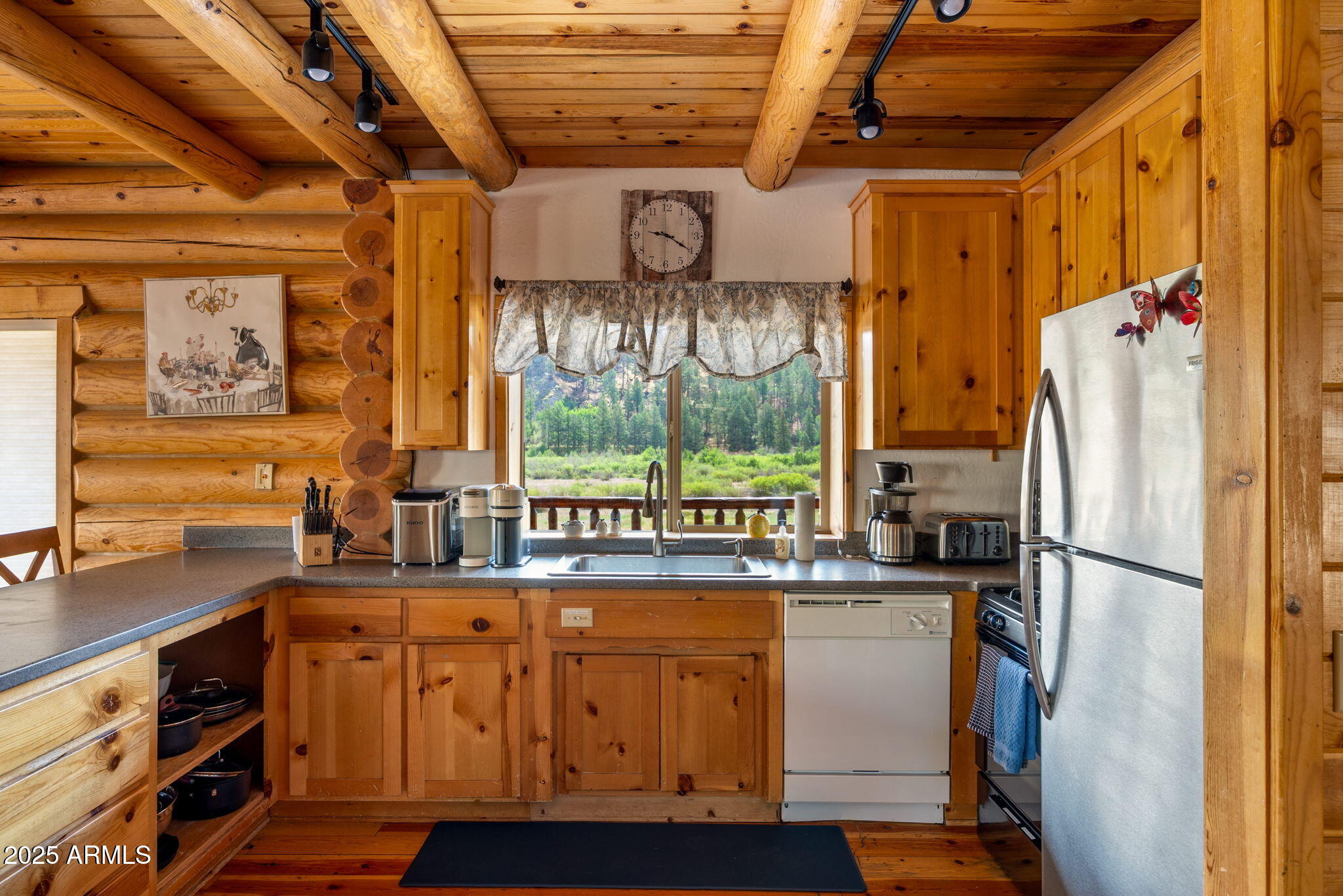 100 Main Street Greer, AZ 85925 - Photo 19 of 63 a kitchen with stainless steel appliances granite countertop a refrigerator and a stove