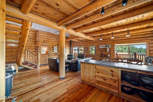 a bathroom with a granite countertop sink mirror and a bathtub